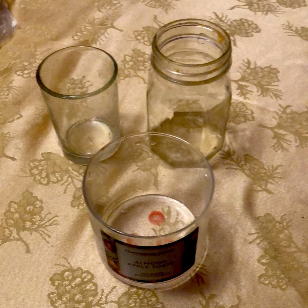 Set of three glass jars and candle holders